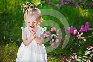 Adorable little girl laughing and playing their hands