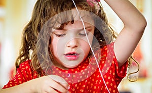 Adorable little girl making crafts