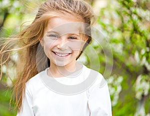 Adorable little girl on the meadow