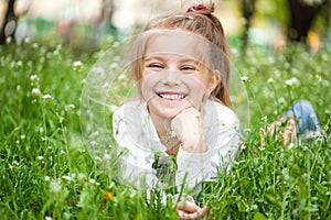 Adorable little girl on the meadow