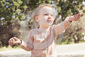 Adorable little girl playing in a park