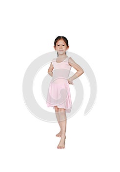 Adorable little girl practicing her ballet isolated on white background. Children is studying ballet