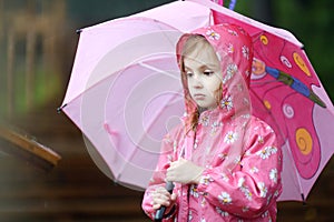 Adorable little girl at rainy day