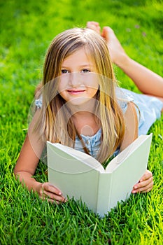 Adorable little girl reading book