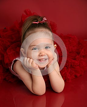 Adorable little girl in red pettiskirt tutu