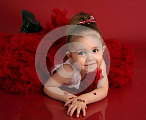 Adorable little girl in red pettiskirt tutu