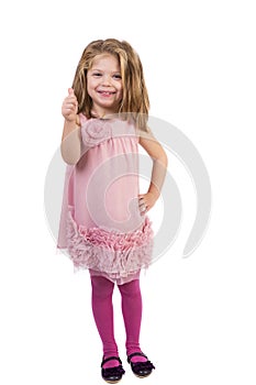 Adorable little girl showing thumb up