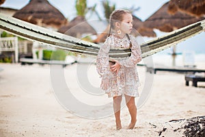 Adorable little girl on tropical vacation relaxing