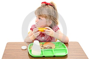 Adorable Little Girl Unhappy with School Lunch photo