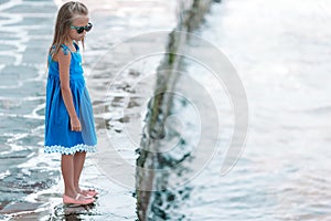 Adorable little girl at Little Venice the most popular tourist area on Mykonos island, Greece.