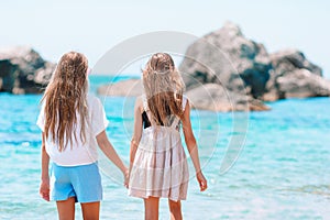 Adorable little girls having fun on the beach