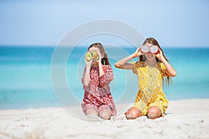 Adorable little girls having fun on the beach