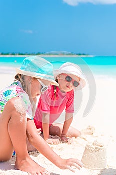 Adorable little girls during summer vacation on the beach