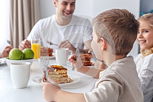 adorable little kids having breakfast