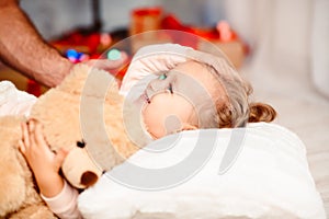 Adorable little little girl going to sleep on Xmas night