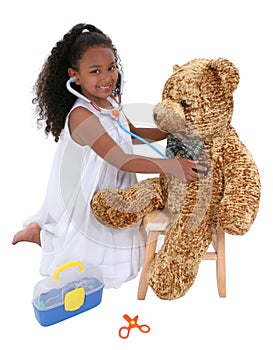 Adorable Little Playing Doctor To A Teddy Bear Over White