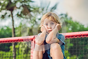 Adorable little toddler boy having fun on playground