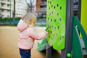 Adorable little toddler girl on playground