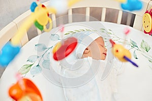 adorable new born baby sleeping in bed