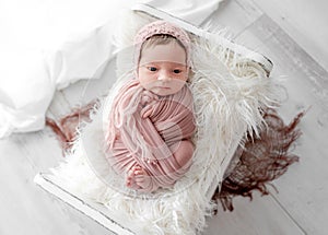 Adorable newborn baby girl portrait