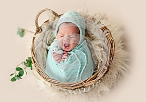 Adorable newborn yawning