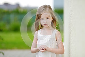 Adorable preschooler girl portrait outdoors