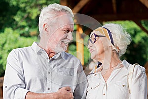 Adorable senior people looking at each other and smiling