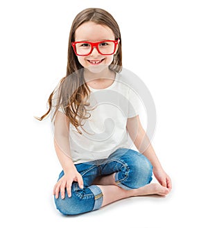 Adorable small girl is sitting down