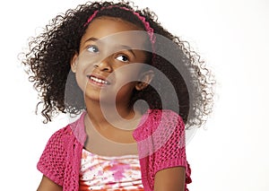 Adorable smiling little girl with curly hair