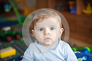 Adorable toddler with blue eyes indoor