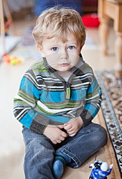 Adorable toddler with blue eyes indoor