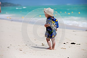 Adorable toddler boy in summer holiday resort in Mauritius, casually dressed