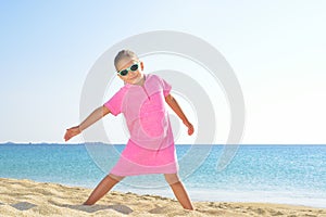 Adorable toddler girl at beach