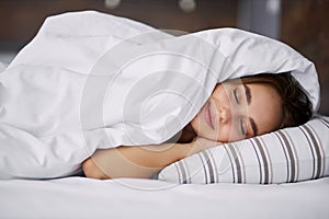 Adorable woman enjoy sleeping on bed