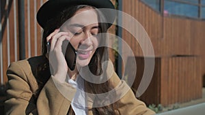 Adorable woman having conversation over the phone.
