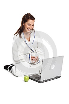 Adorable woman sitting down watching her computer screen