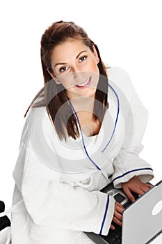 Adorable woman sitting down watching her computer screen