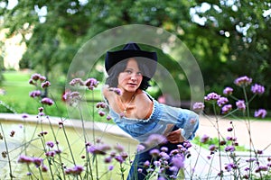 Adorable young brunette in cowboy style