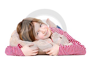 Adorable young girl holding teddy bear
