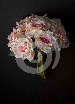 floral ornament of white roses on a black background photo