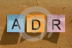 ADR word from colorful paper notes on wall