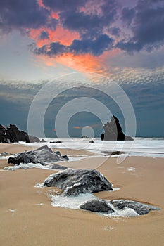 Adraga beach at sunset