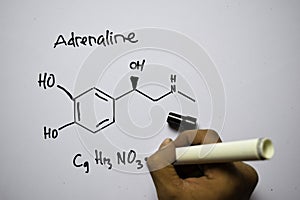 Adrenaline C9,H13,NO3 molecule written on the white board. Structural chemical formula. Education concept