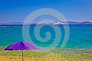 Adriatic beach in Zadar with megayacht background photo