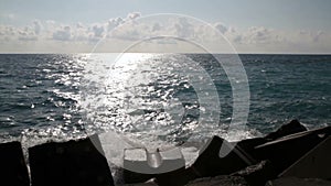 Adriatic Sea, Calabria, Italy sea with breakwater with clouds