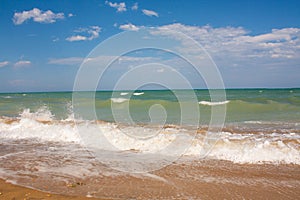 Adriatic Sea coast view. Seashore of Italy, summer sandy beach with clouds on horizon.