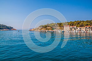 Adriatic sea shore with small leisure boats inside the harbor of Makarska City