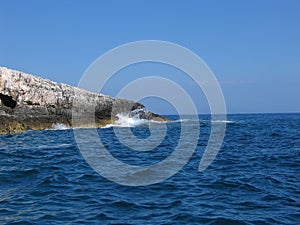 Adriatic waves hitting Cap Kamenjak in Croatia. photo