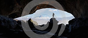 Adult adventurous man standing in a cave. 3d rendering mountain adventure artwork.