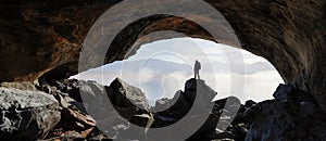 Adult adventurous man standing in a cave. 3d rendering mountain adventure artwork.